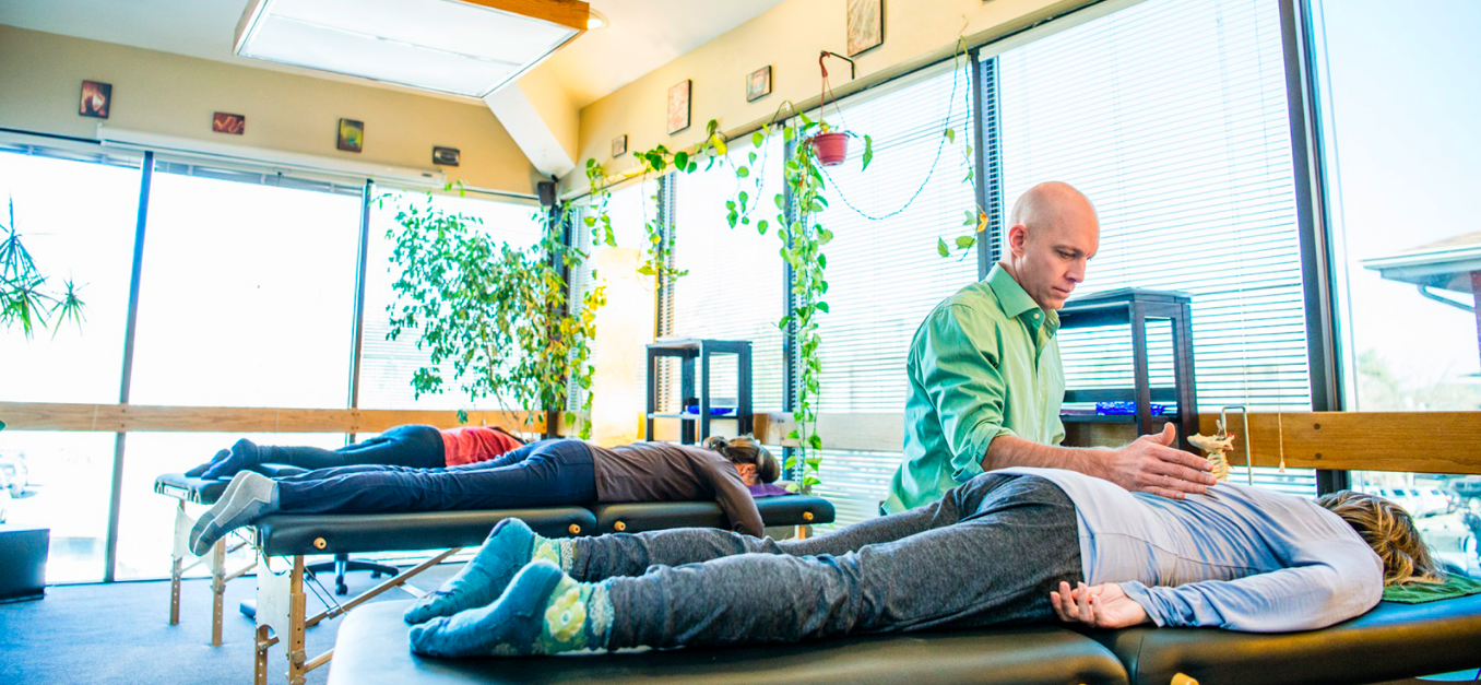 dr jay uecker performing biosoul integration on some clients at the biosoul integration center