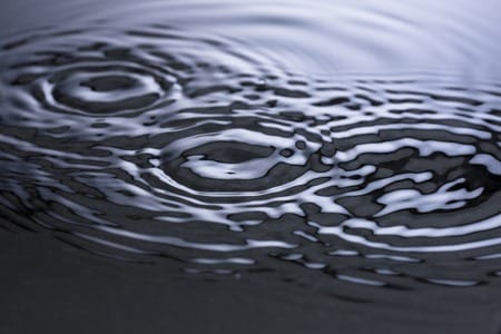 multiple drops of water representing criss cross of waves of influence spiritual healing