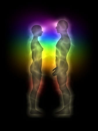 man and woman standing with energy body overlapping