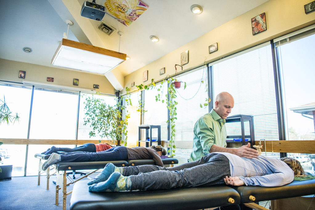Dr. Jay performing biosoul integration at his holistic healing center