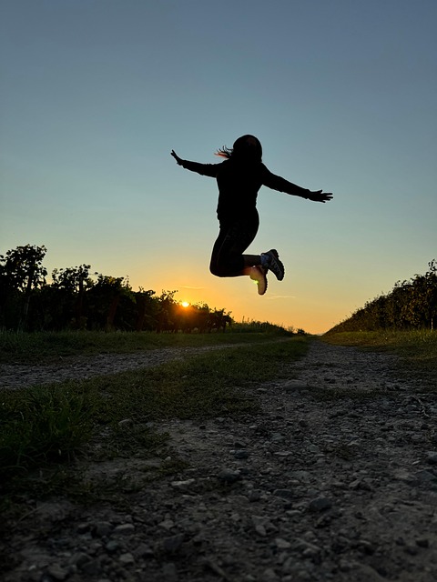 a women jumpin into the air a female being empowered