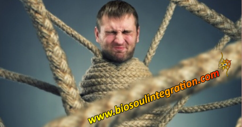 a man wrapped in rope, stuck