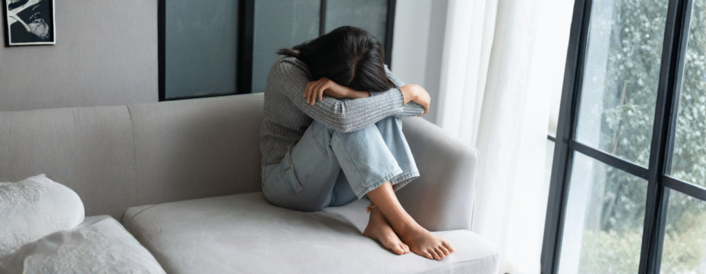 A woman curled up in a sofa