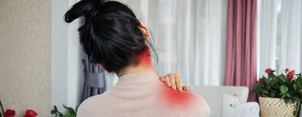 a woman experiencing shoulder and neck pain
