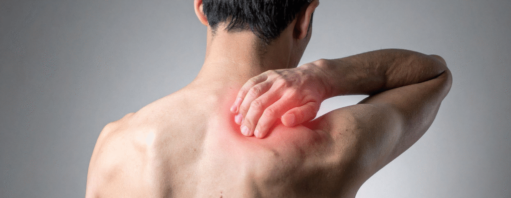A man experiencing back and shoulder pains